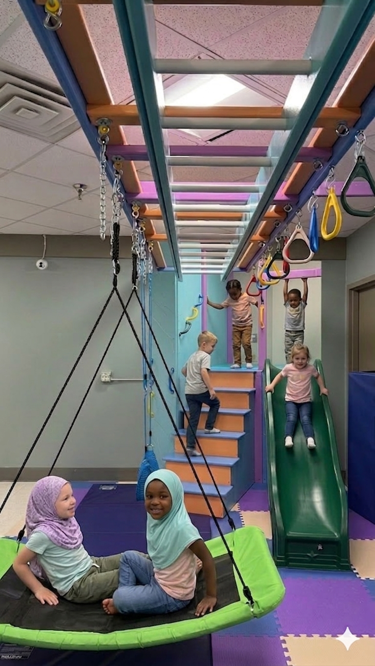 Children playing on swing and climbing structures at Future Scholars Center